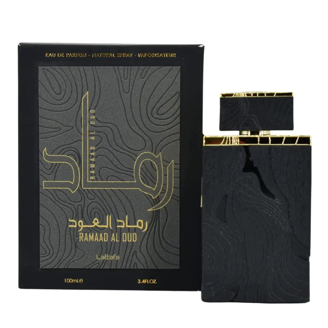 Black and gold perfume bottle with packaging labeled 'Ramaad Al Oud' on a white background